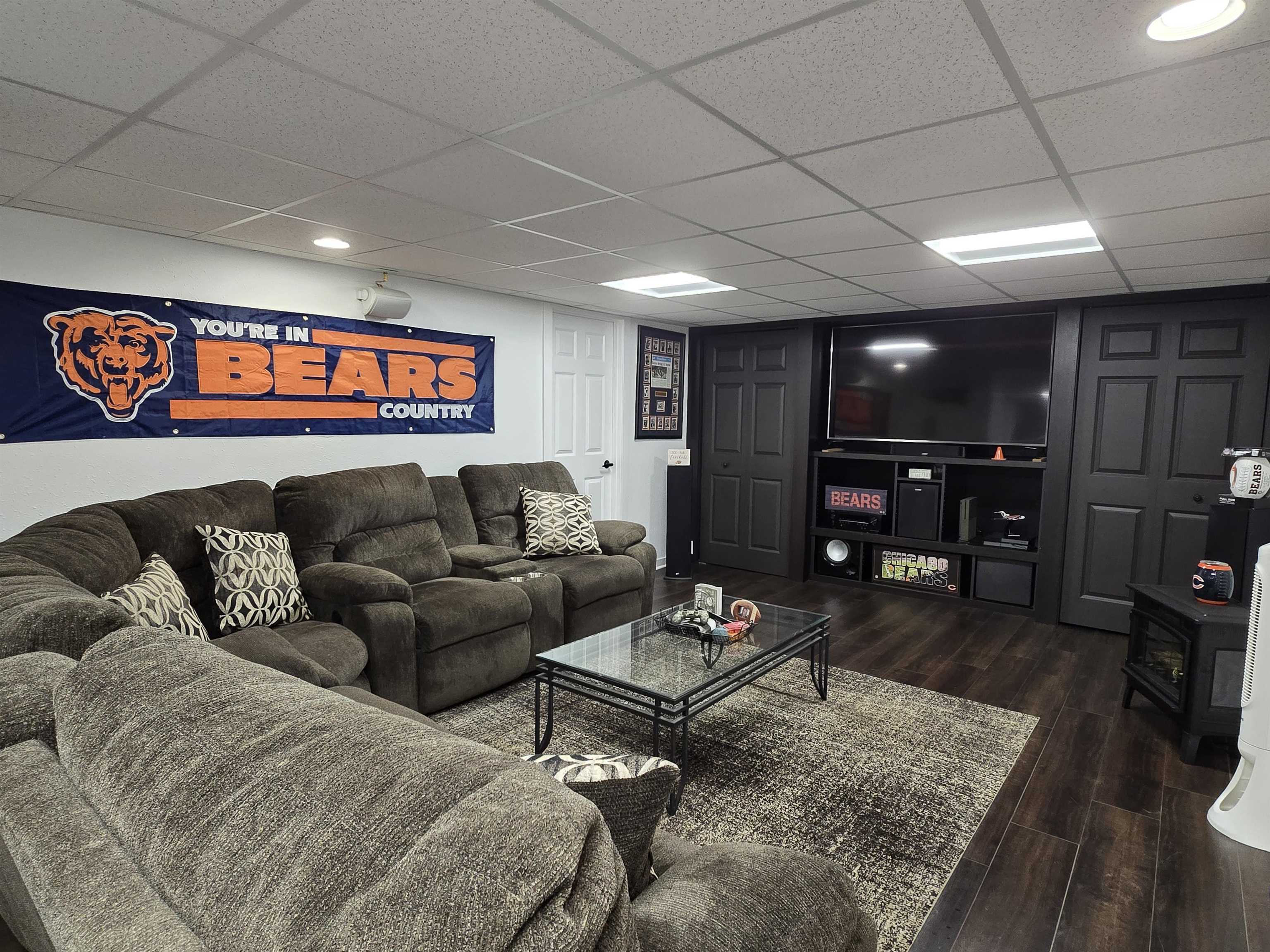11680 Bend River Road Roscoe, IL 61073 - Photo 34 of 47 a living room with furniture and a flat screen tv