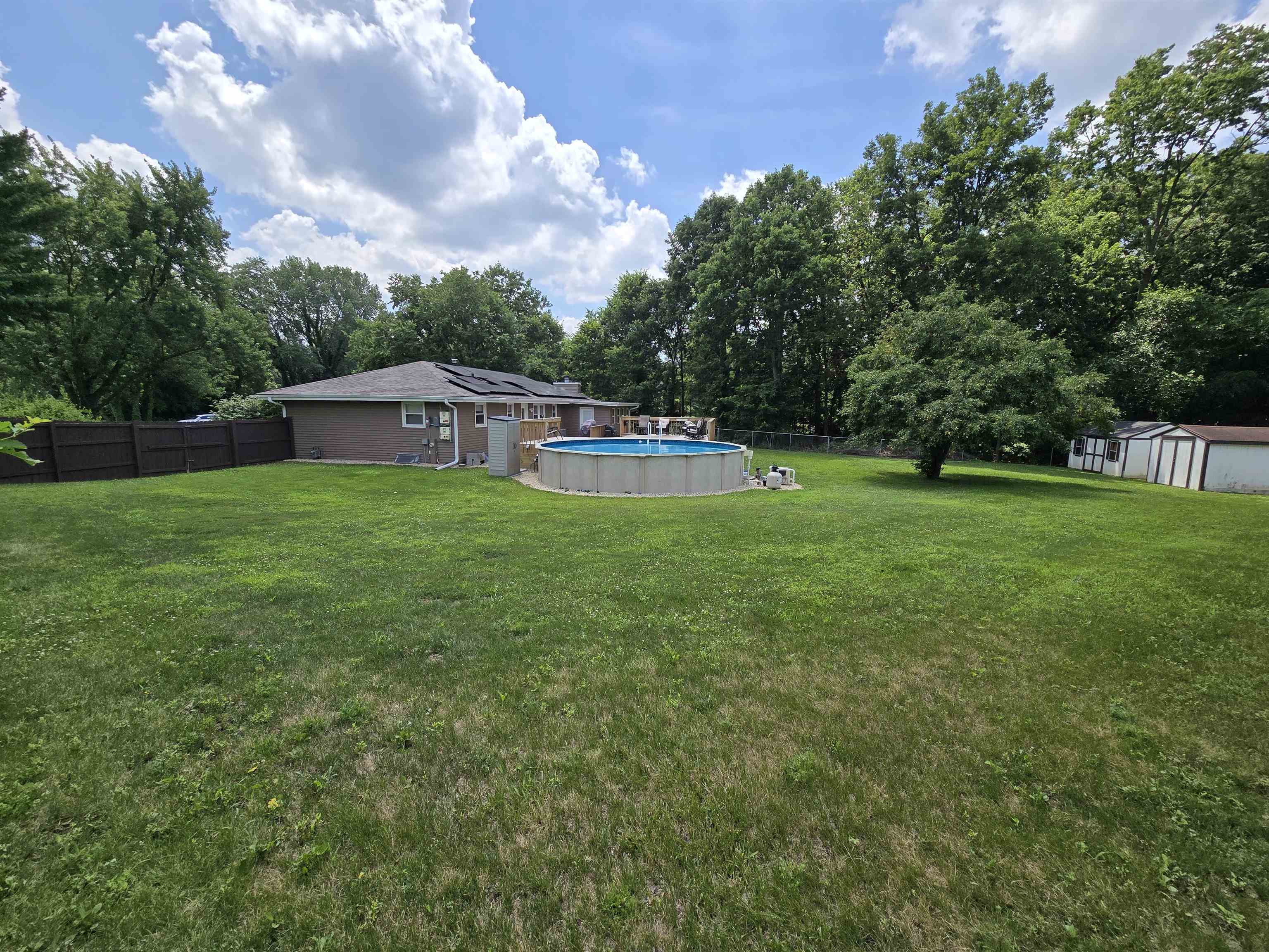 11680 Bend River Road Roscoe, IL 61073 - Photo 8 of 47 a view of a house with a big yard