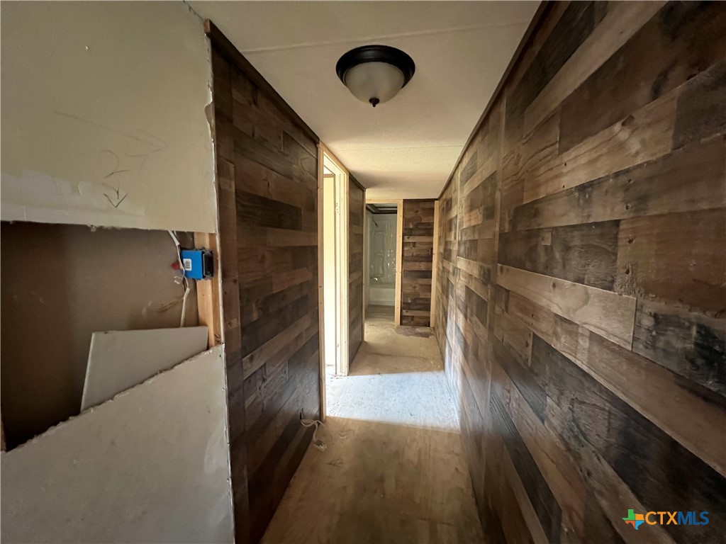 408 Debbie Street Victoria, TX 77905 - Photo 5 of 15 hallway to bedrooms