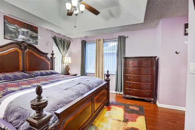 a bed room with a bed and dresser