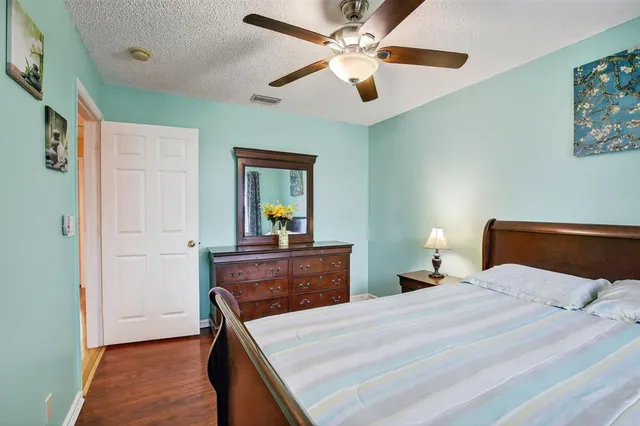 a bedroom with a bed and a dresser