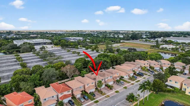 an aerial view of a houses with city view