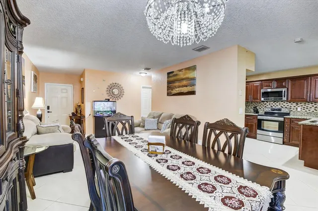 a living room with furniture fireplace and flat screen tv