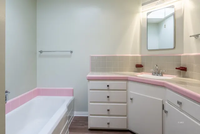 a bathroom with a sink and a mirror