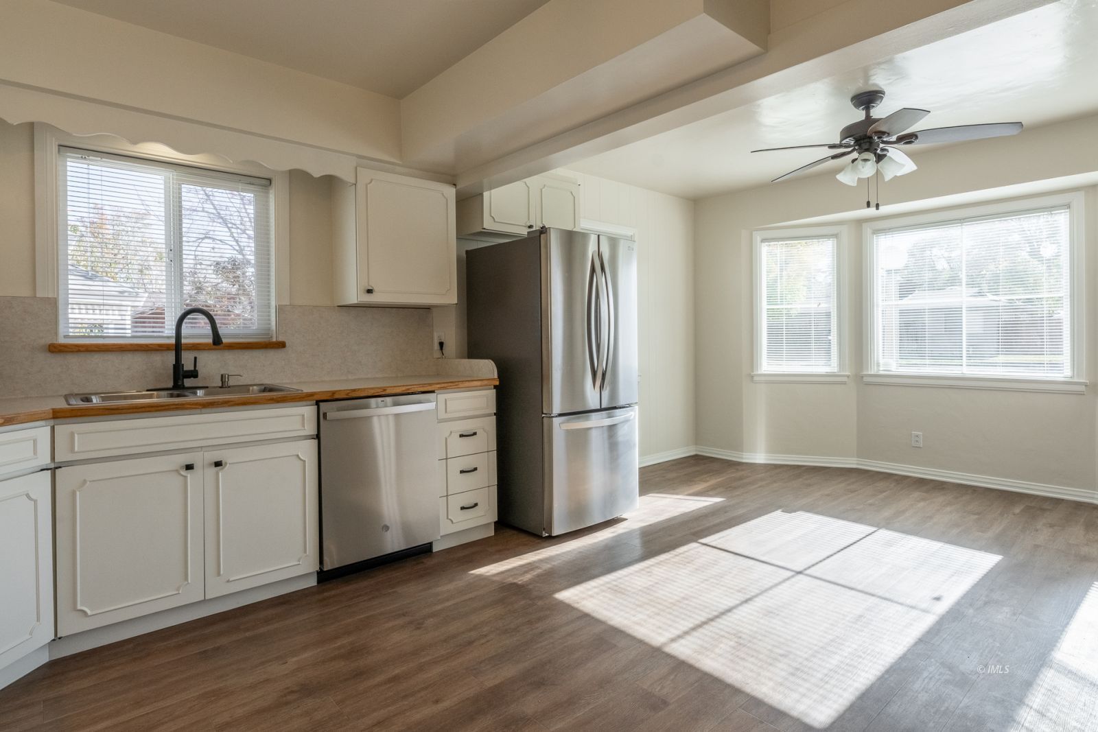 317 West Main Street Independence, CA 93526 - Photo 5 of 33 a kitchen with a refrigerator and windows