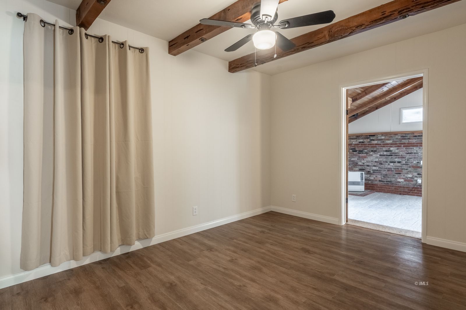 317 West Main Street Independence, CA 93526 - Photo 9 of 33 a view of a livingroom with wooden floor and a ceiling fan