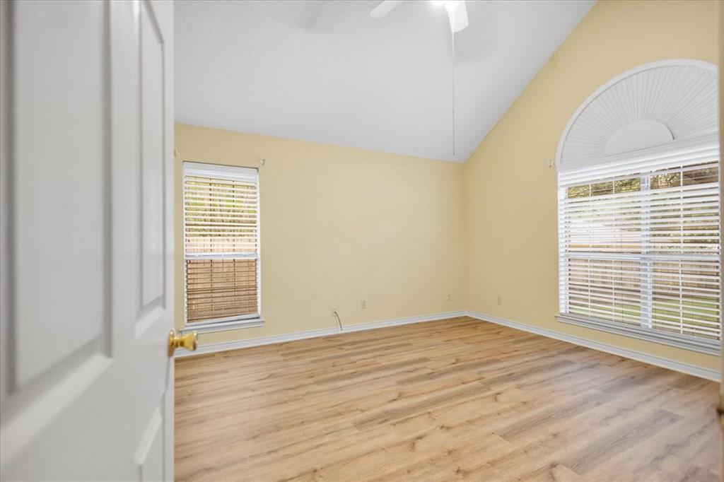 2824 Crestview Avenue Tyler, TX 75701 - Photo 26 of 39 a view of an empty room with wooden floor and a window