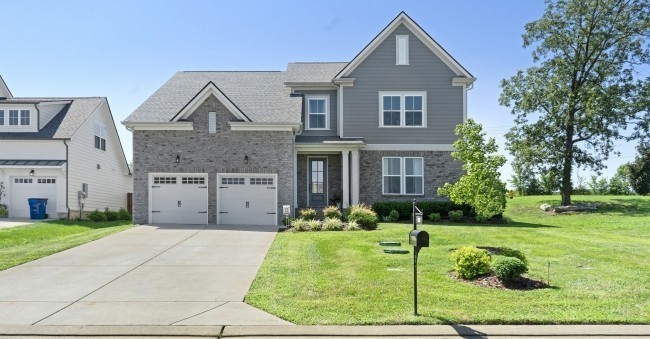 1121 Batbriar Road Murfreesboro, TN 37128 - Photo 1 of 21 a front view of a house with a yard