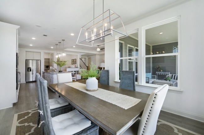 1121 Batbriar Road Murfreesboro, TN 37128 - Photo 7 of 21 a view of a dining room and livingroom with furniture wooden floor a chandelier