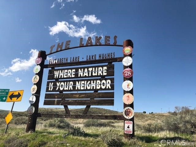 0 Elizabeth Lake Road Lake Hughes, CA 93532 - Photo 9 of 33 a front view of a house with swimming pool and porch