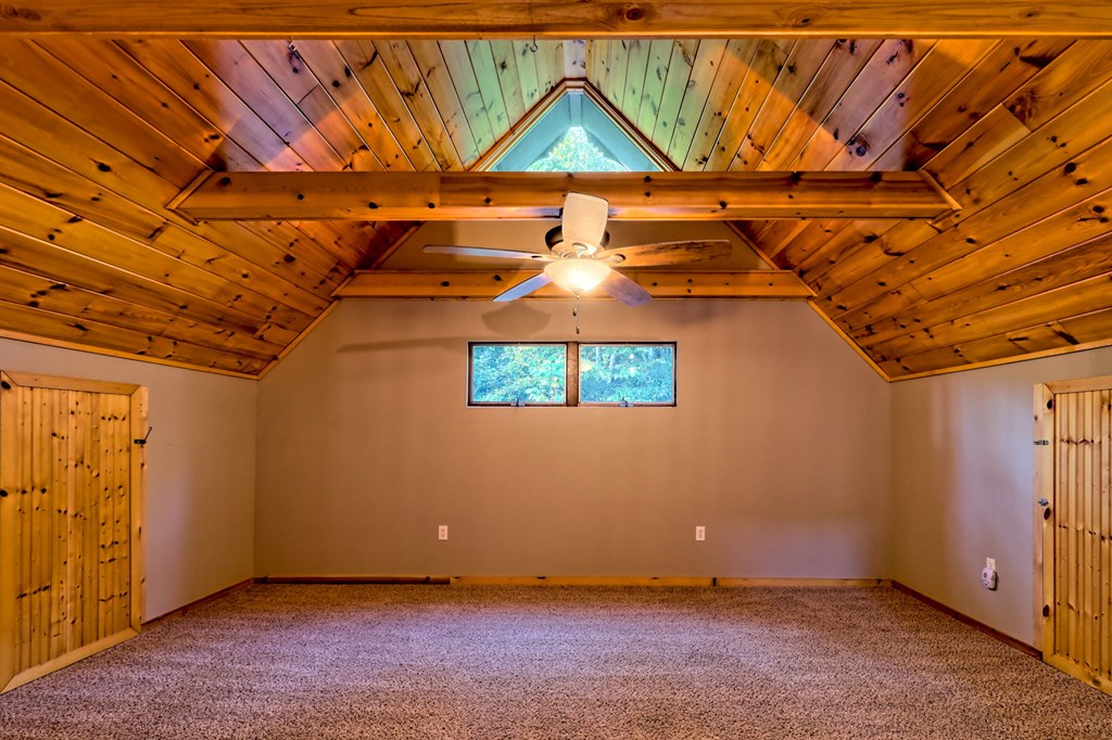 206 Peckerwood Road Hayesville, NC 28904 - Photo 25 of 75 Bonus room or primary den, Extra storage for boxes and holiday items on both sides! Mini splits provide custom programmable temps for specific areas!