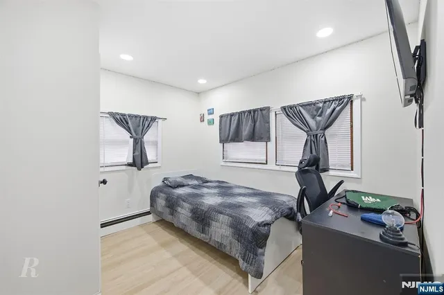 a bedroom with bed and window