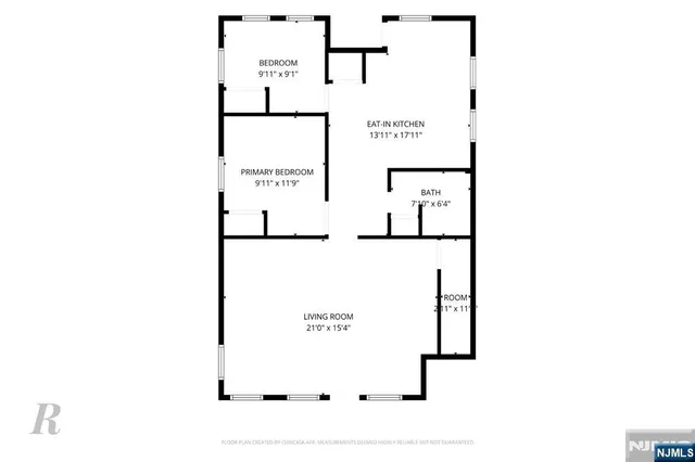 a picture of a bench in front of a wall