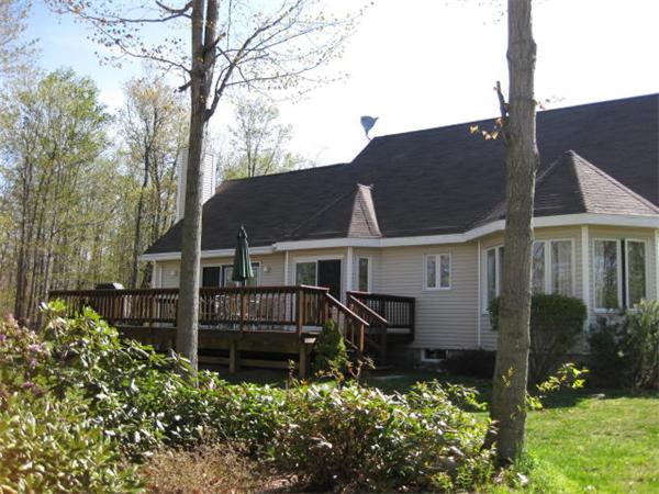 715 George Carter Road Becket, MA 01223 - Photo 5 of 22 front view of house with a yard