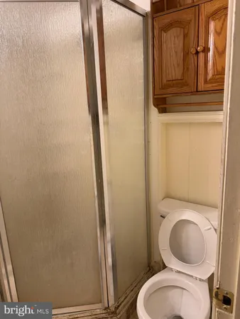 a bathroom with a toilet and a sink