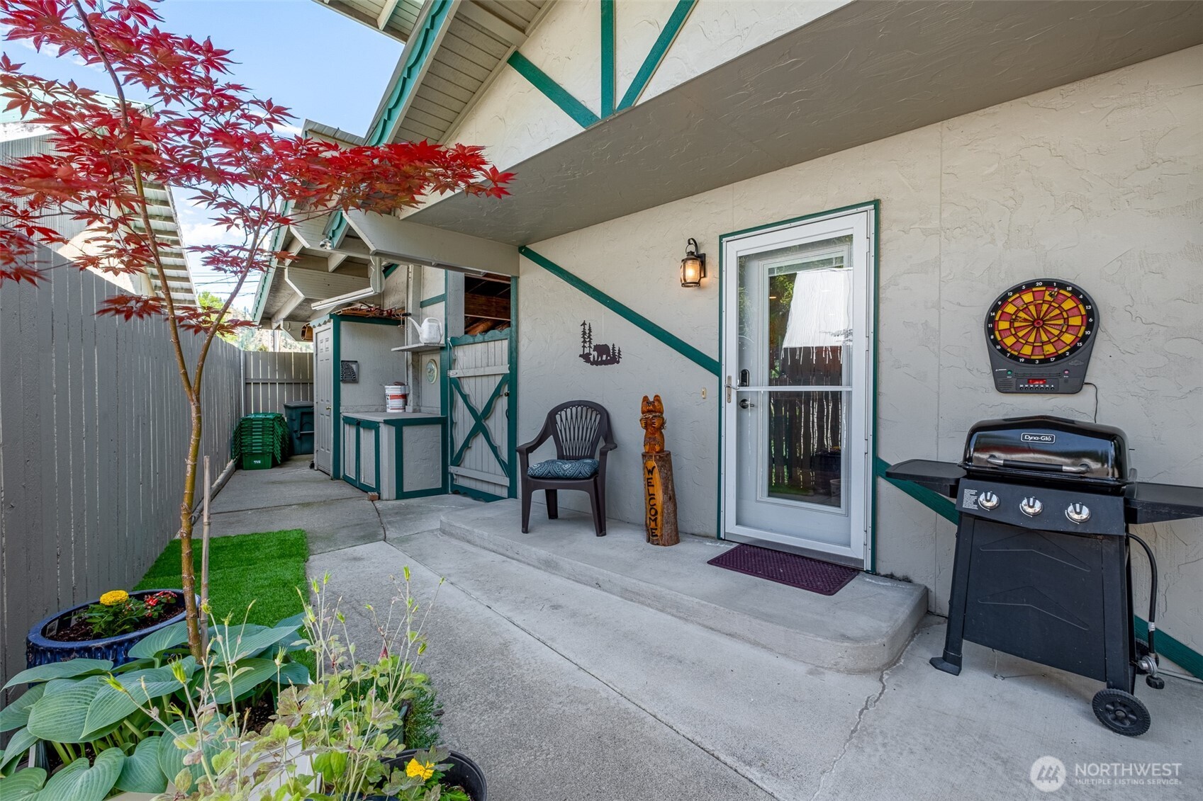 8348 Main Street, Unit 1 Peshastin, WA 98847 - Photo 34 of 40 a backyard of a house with barbeque oven and a stove