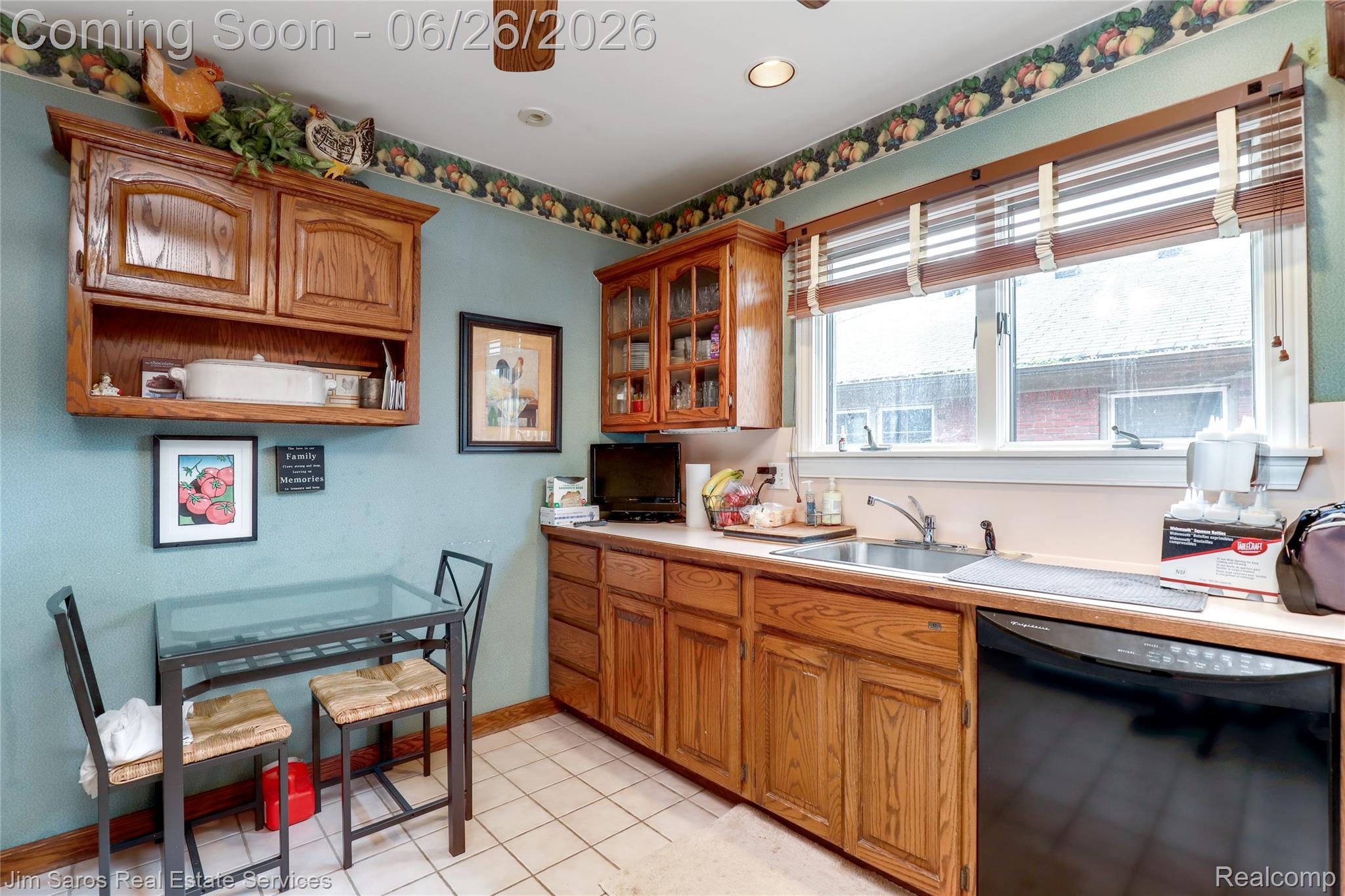 764 Harcourt Road Grosse Pointe, MI 48230 - Photo 21 of 42 Kitchen featuring wood-finish cabinetry, tile flooring, and a stainless steel sink