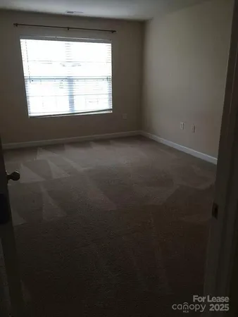 a view of a room that has a window in it