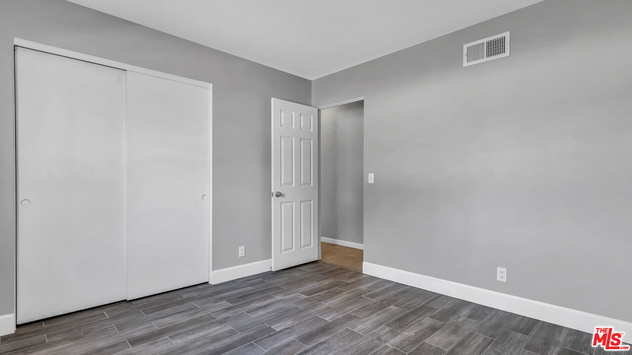 494 North Monterey Road Palm Springs, CA 92262 - Photo 21 of 30 a view of an empty room with wooden floor