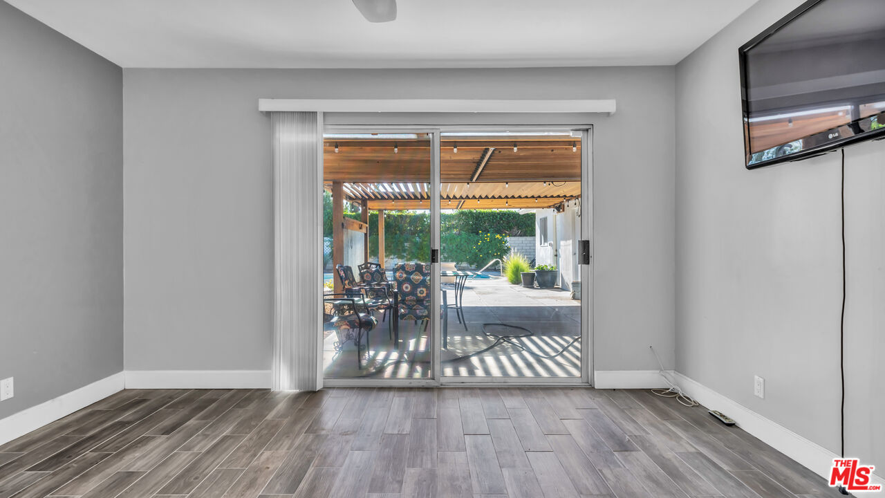 494 North Monterey Road Palm Springs, CA 92262 - Photo 23 of 30 a view of empty room with wooden floor and fan