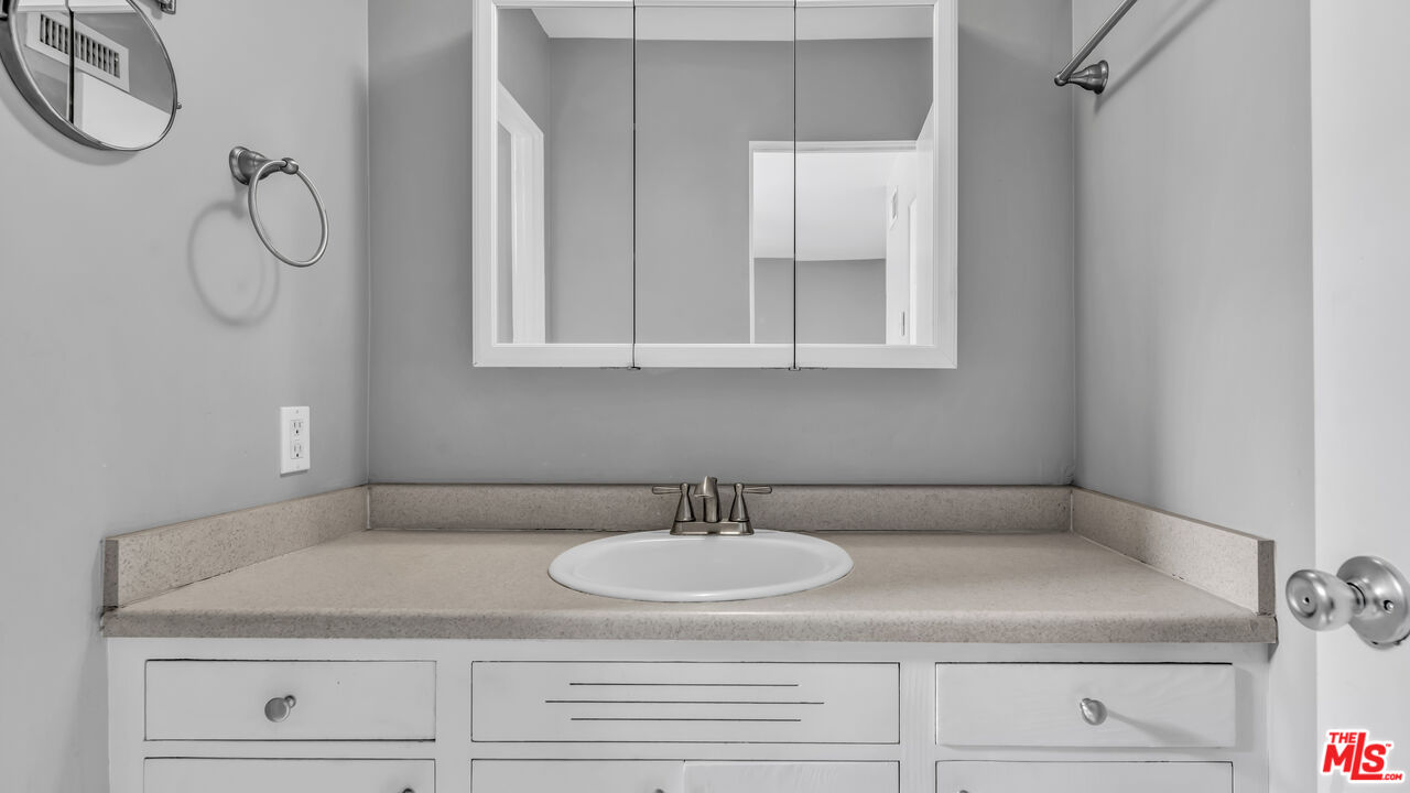 494 North Monterey Road Palm Springs, CA 92262 - Photo 25 of 30 a bathroom with a sink and a mirror