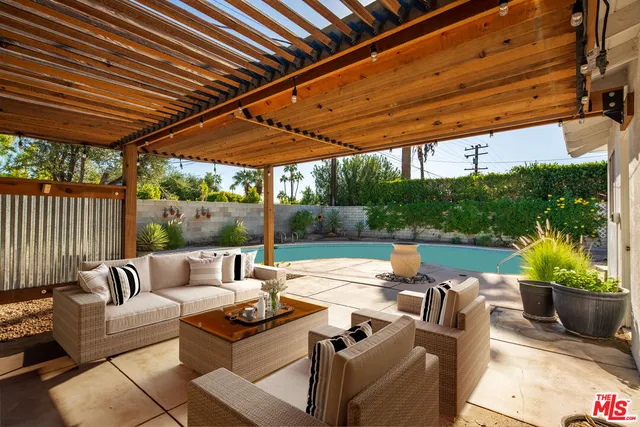 a outdoor living space with furniture and garden view