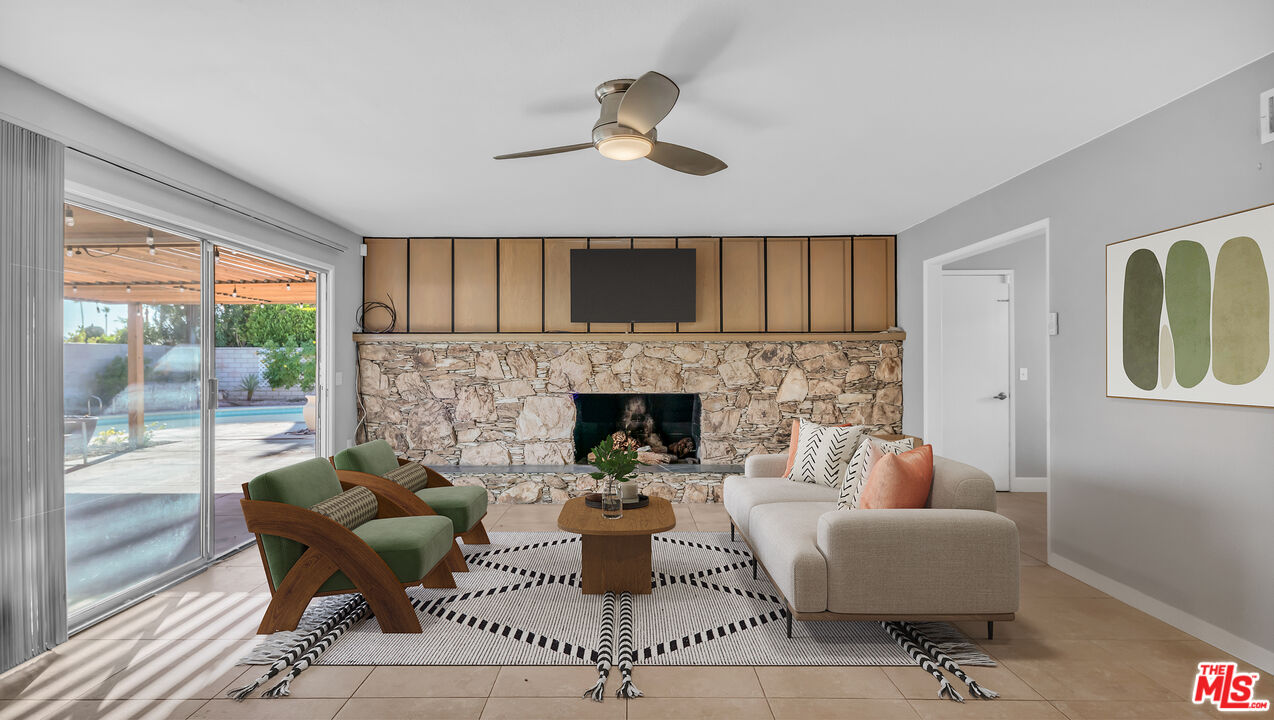 494 North Monterey Road Palm Springs, CA 92262 - Photo 4 of 30 a living room with furniture and a fireplace