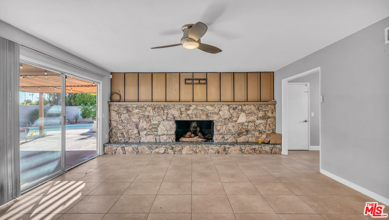 494 North Monterey Road Palm Springs, CA 92262 - Photo 8 of 30 a living room with furniture and a fireplace