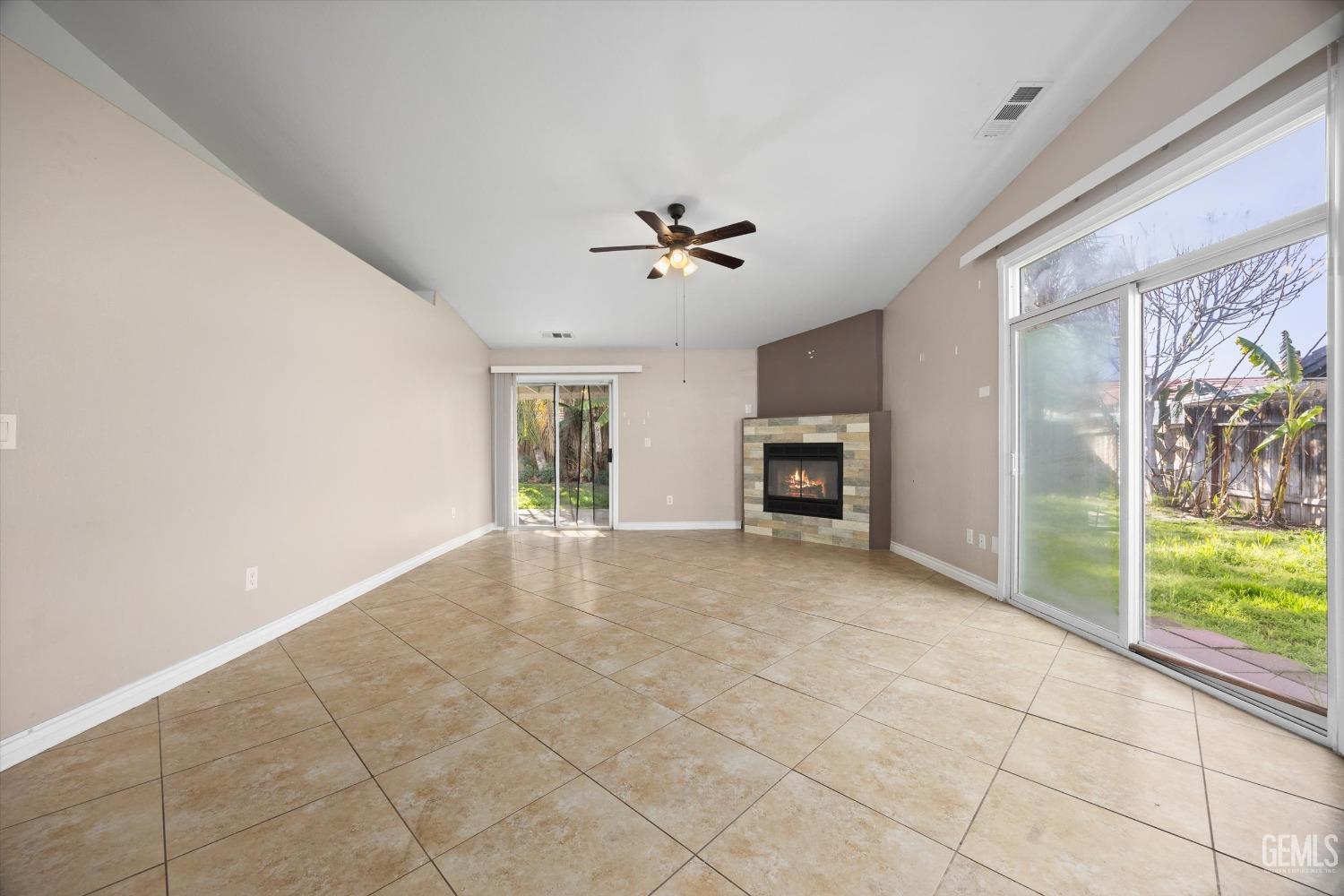 Undisclosed Address Bakersfield, CA 93312 - Photo 12 of 38 a view of a livingroom with furniture and a ceiling fan