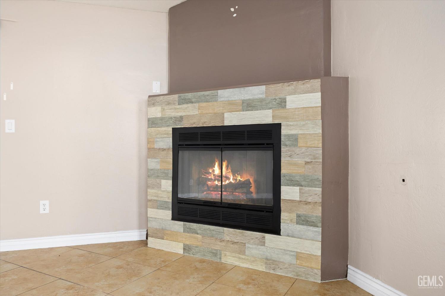 Undisclosed Address Bakersfield, CA 93312 - Photo 13 of 38 a fireplace with a hallway