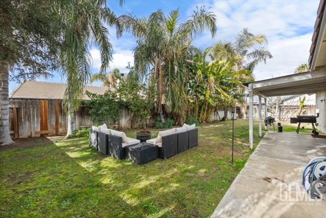 Undisclosed Address Bakersfield, CA 93312 - Photo 36 of 38 a backyard of a house with yard and outdoor seating