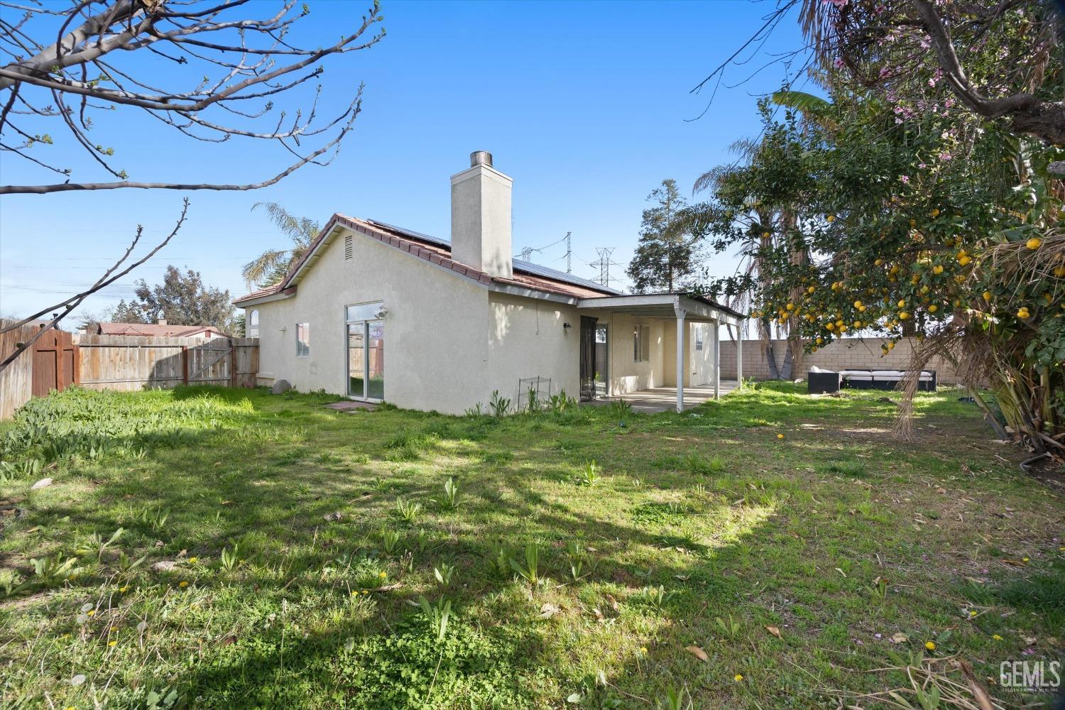Undisclosed Address Bakersfield, CA 93312 - Photo 37 of 38 a view of a house with a backyard