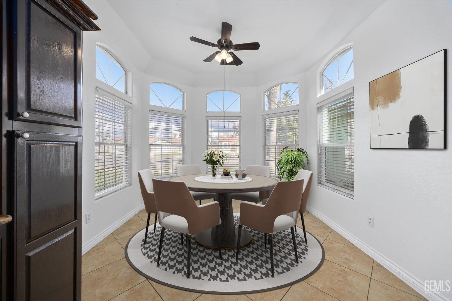 Undisclosed Address Bakersfield, CA 93312 - Photo 5 of 38 a view of a dining room with furniture a chandelier and wooden floor