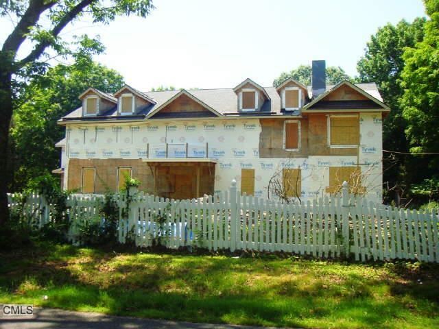 3509 Redding Road Fairfield, CT 06824 - Photo 1 of 1 a front view of a house with a yard