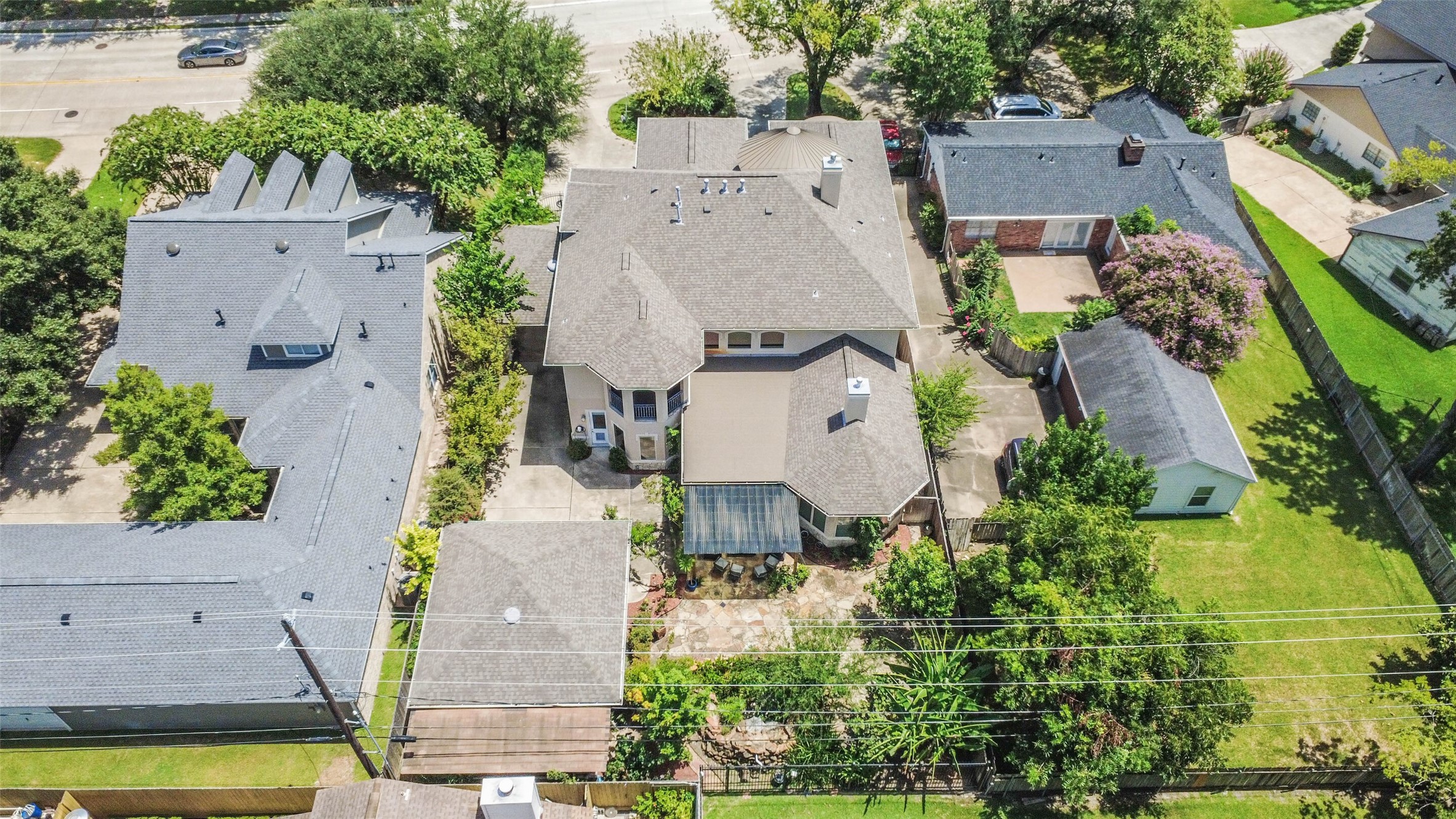 Another aerial view of the property showcasing the home and spacious outdoor area