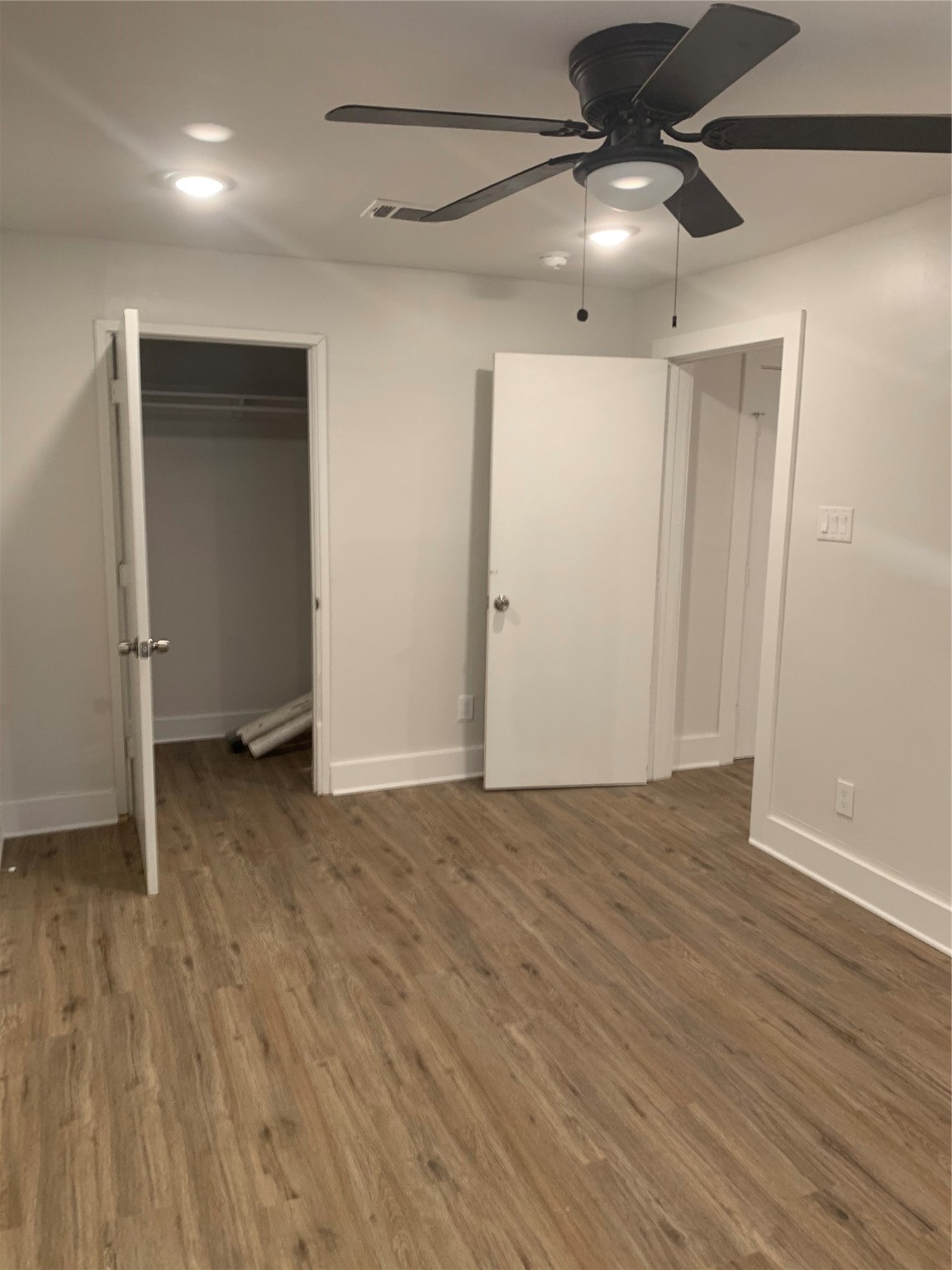 548 Majestic Street, Unit R Houston, TX 77020 - Photo 2 of 6 a view of an empty room with wooden floor