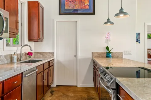 a bedroom with a bed and a potted plant
