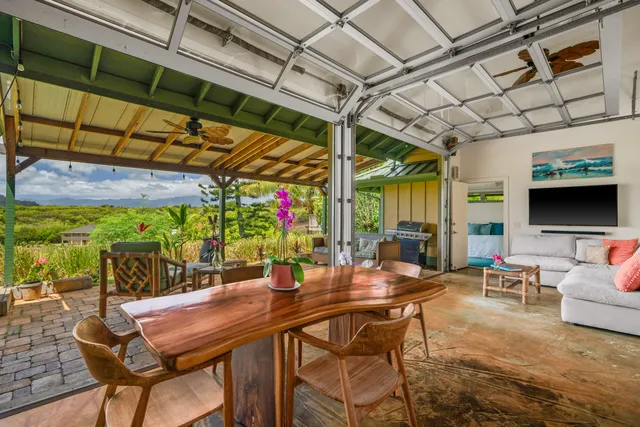 a view of a dining table and chairs in the patio