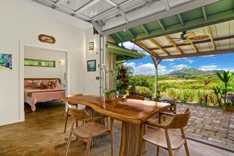 a kitchen with a stove and a chandelier