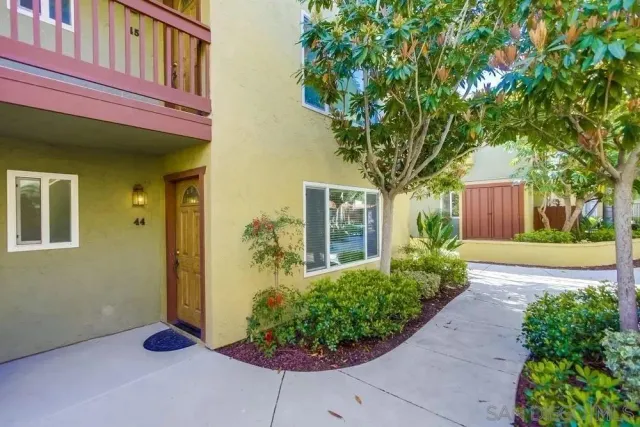 a front view of a house having yard