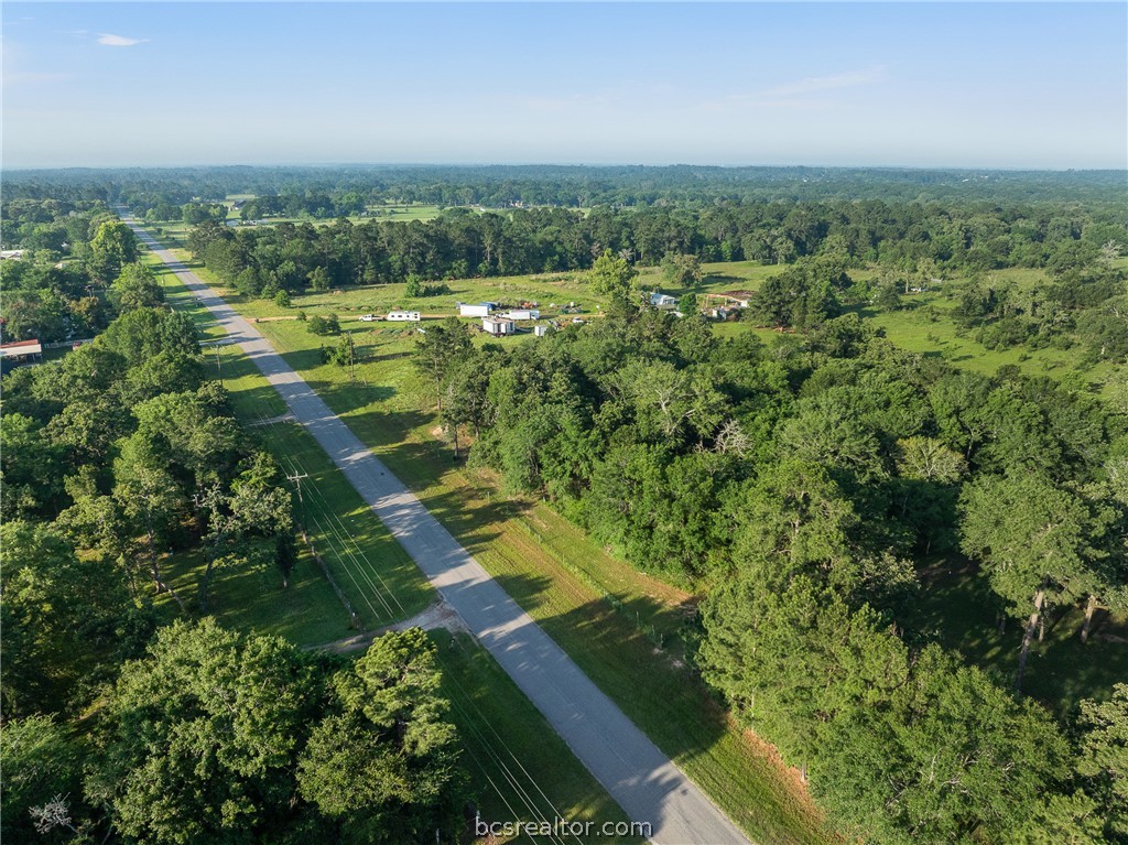 26795 Rice Road Hockley, TX 77447 - Photo 2 of 19 an aerial view of residential houses with outdoor space and trees