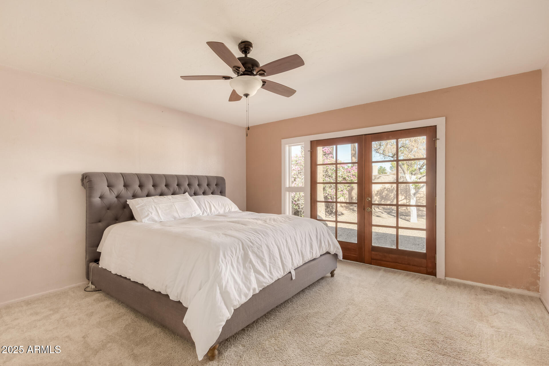 1220 East Julie Drive Tempe, AZ 85283 - Photo 14 of 32 a spacious bedroom with a large bed and a large window