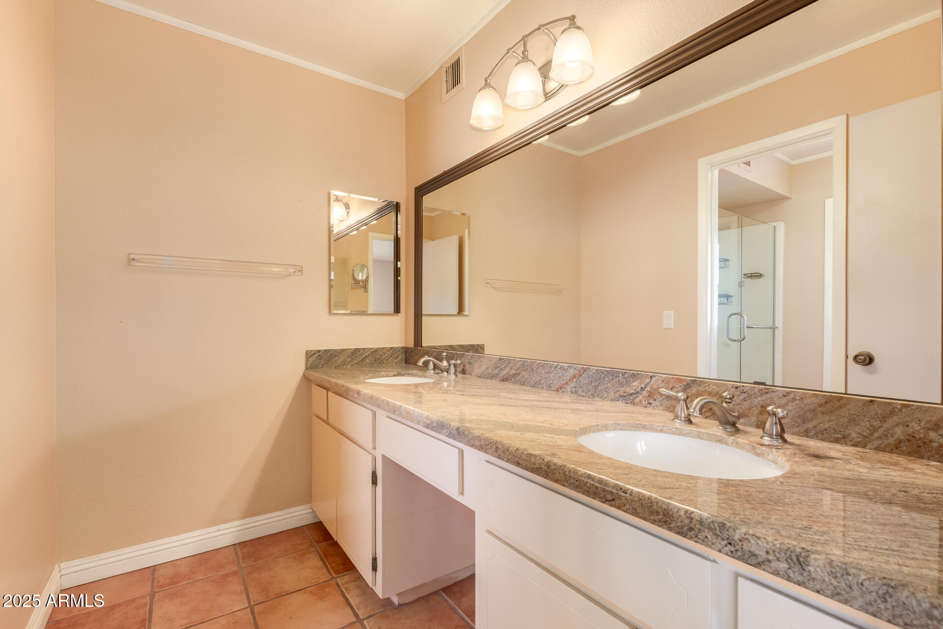 1220 East Julie Drive Tempe, AZ 85283 - Photo 16 of 32 a bathroom with a granite countertop sink and a mirror