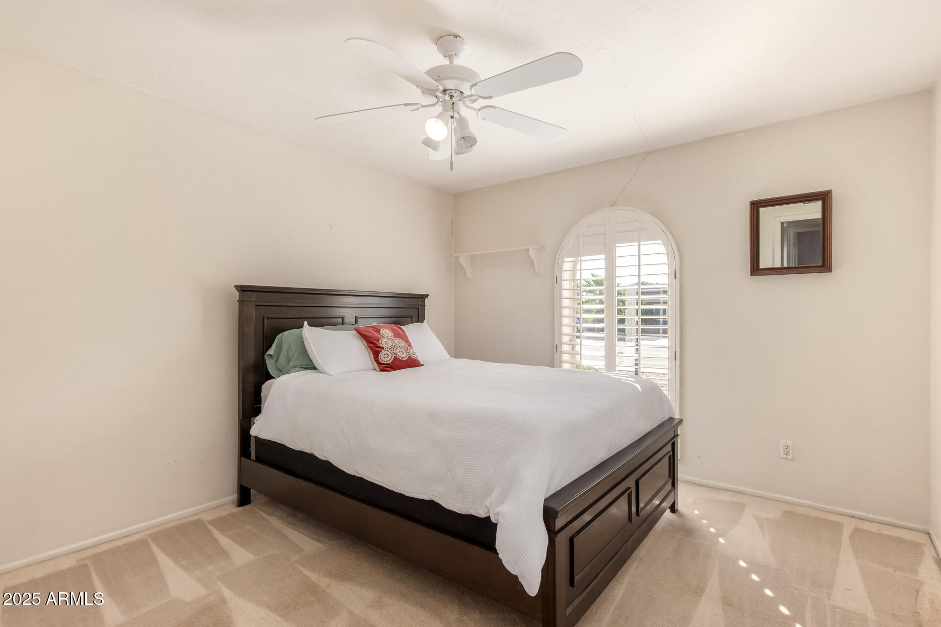 1220 East Julie Drive Tempe, AZ 85283 - Photo 17 of 32 a bed sitting in a bedroom next to a window
