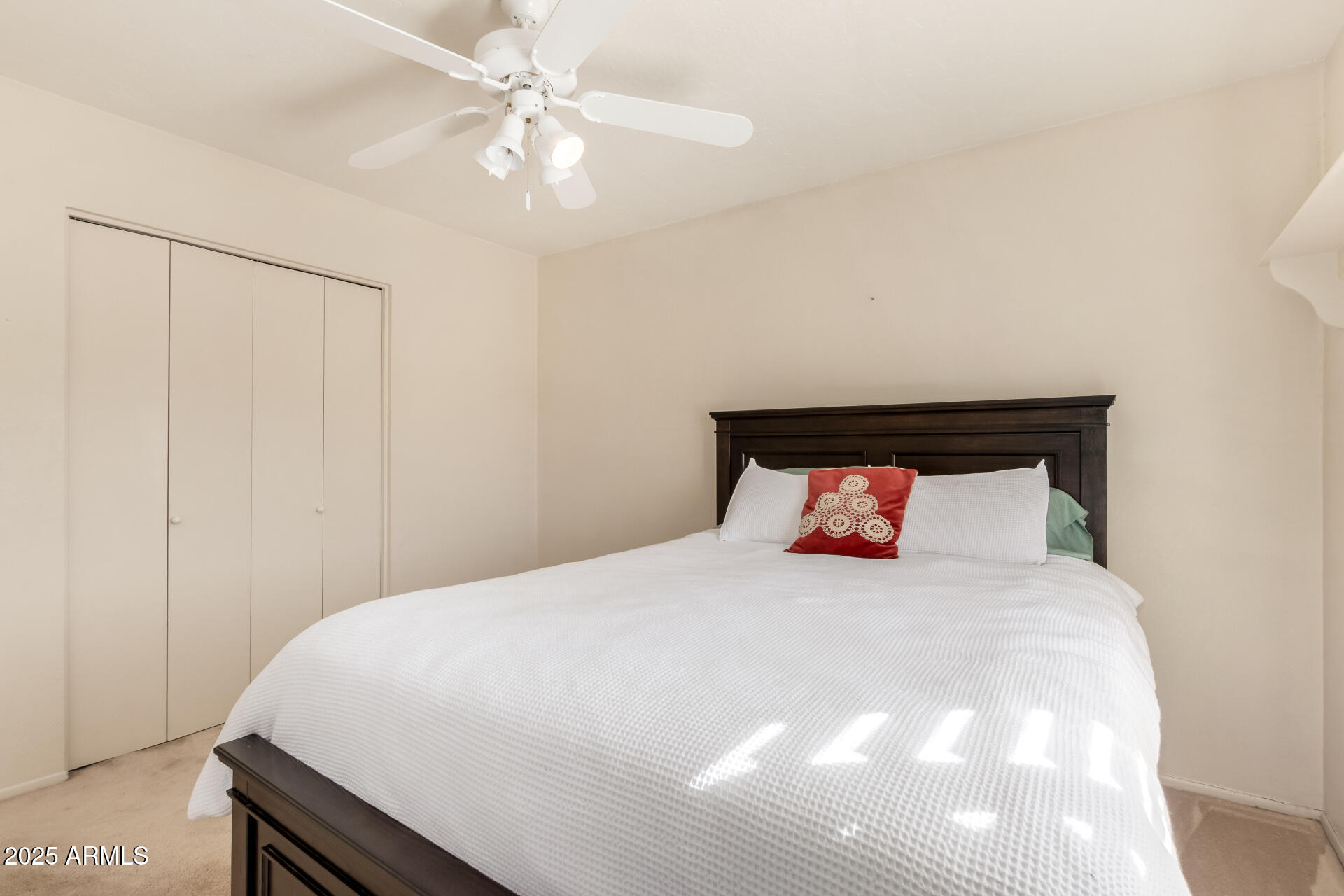1220 East Julie Drive Tempe, AZ 85283 - Photo 18 of 32 a bedroom with a white bed and a ceiling fan