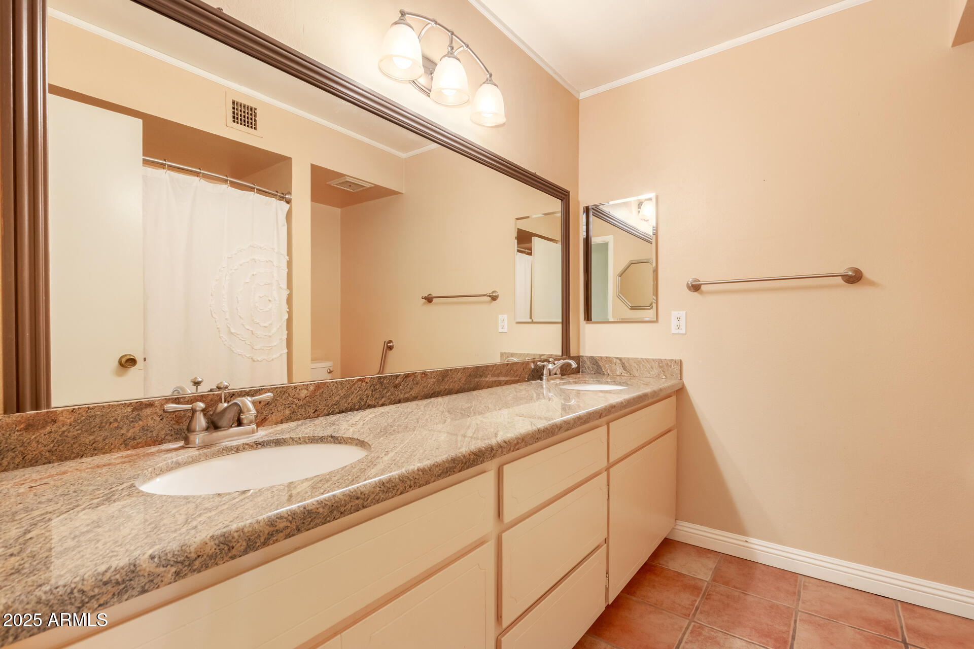 1220 East Julie Drive Tempe, AZ 85283 - Photo 21 of 32 a bathroom with a granite countertop sink and a mirror