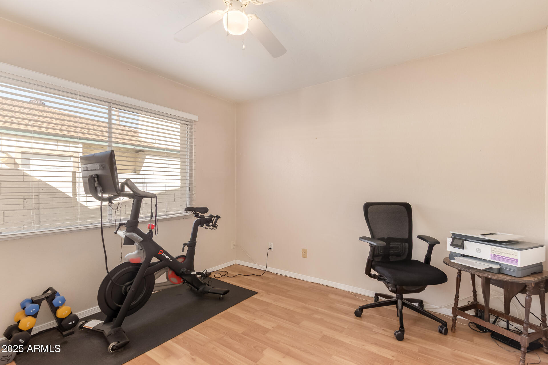 1220 East Julie Drive Tempe, AZ 85283 - Photo 22 of 32 a view of a workspace with furniture and a window