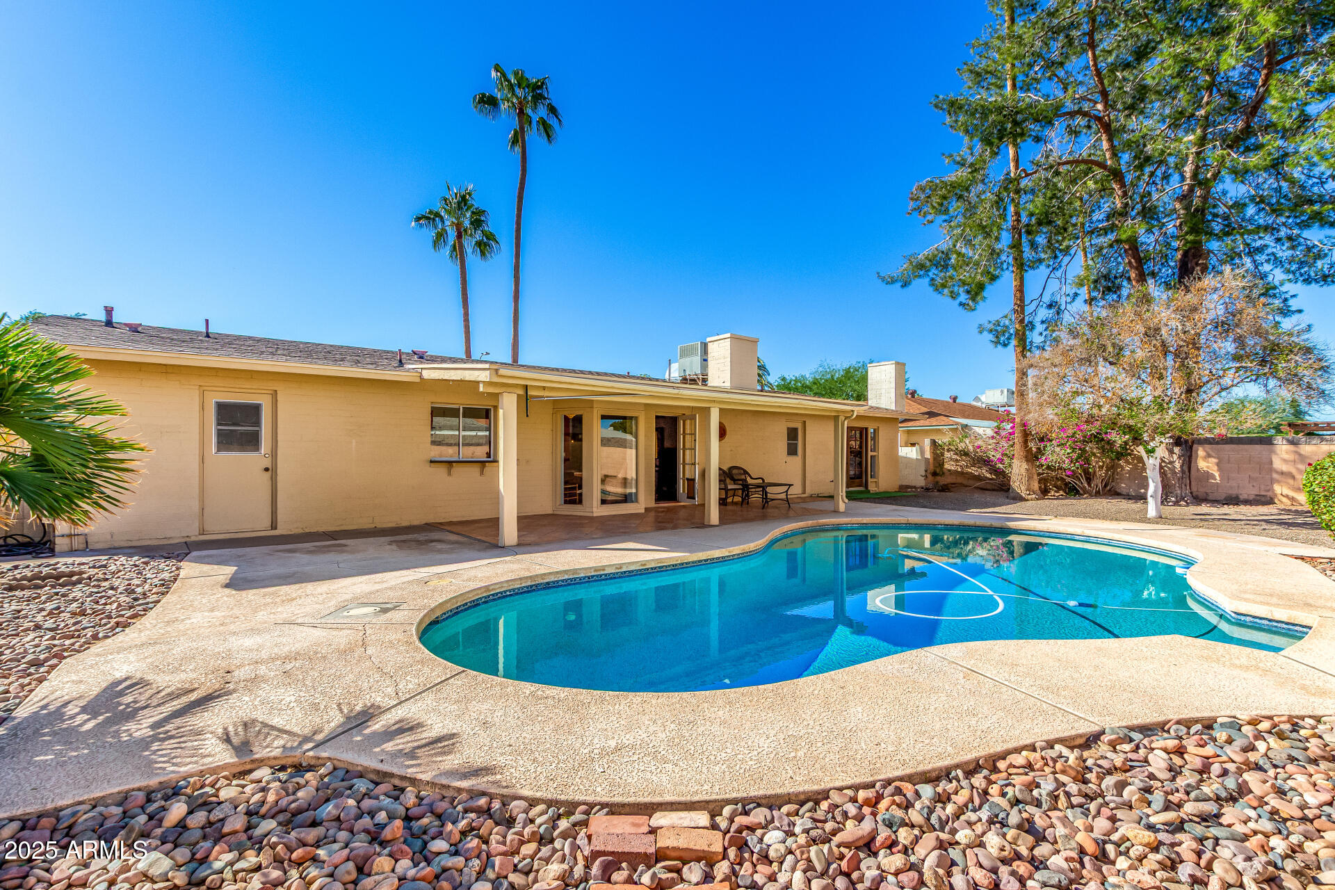 1220 East Julie Drive Tempe, AZ 85283 - Photo 25 of 32 a view of a house with swimming pool