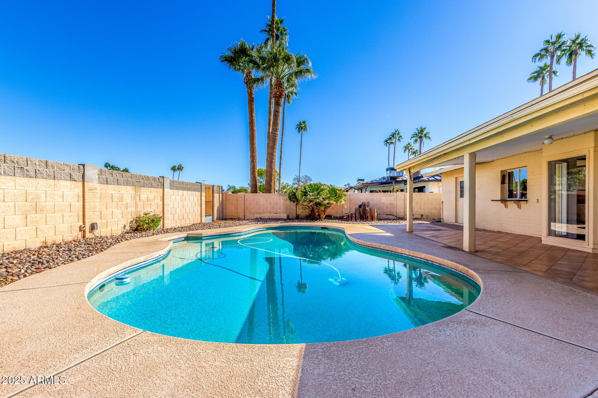 1220 East Julie Drive Tempe, AZ 85283 - Photo 26 of 32 a view of a swimming pool with a lounge chairs