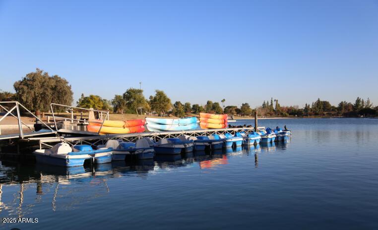 1220 East Julie Drive Tempe, AZ 85283 - Photo 28 of 32 a view of lake with boats and trees in the background